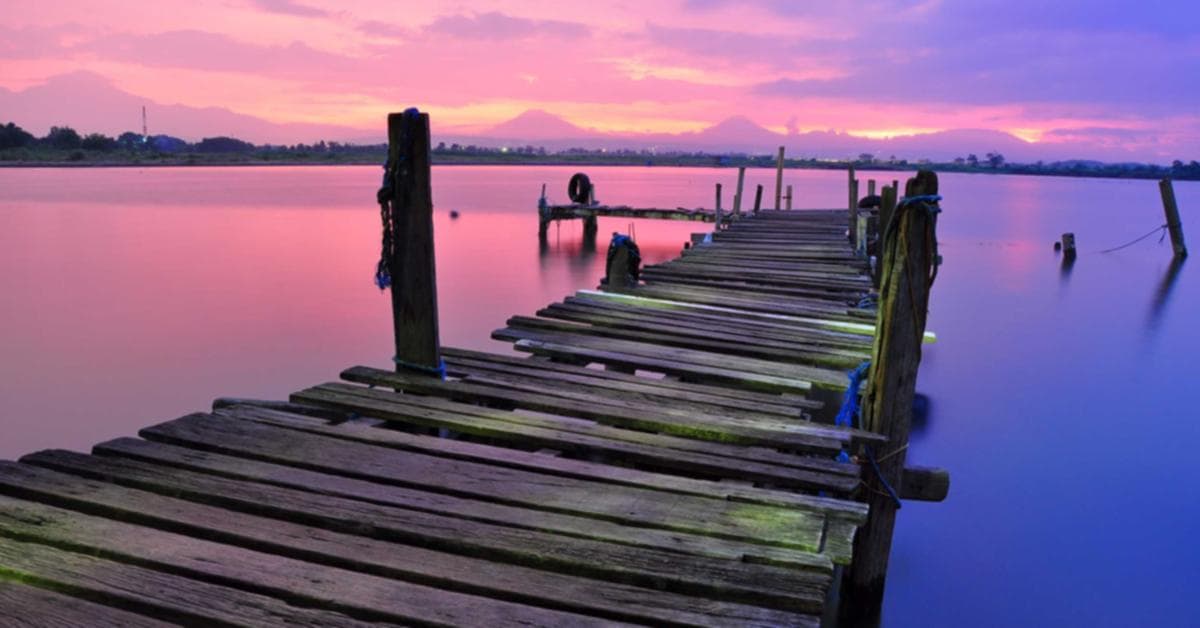 Archery target board with arrows, representing lucky numbers for teer
